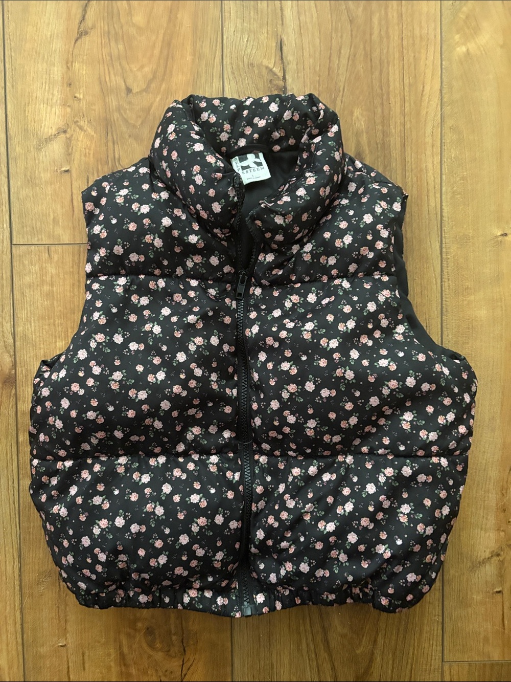 Girl’s black floral puffer vest